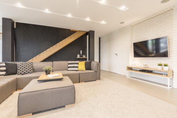 Spacious living room with couch and TV