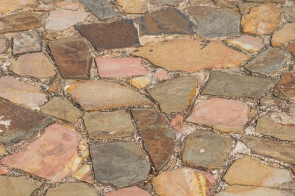 track from textured brown and pink sandstone, Background